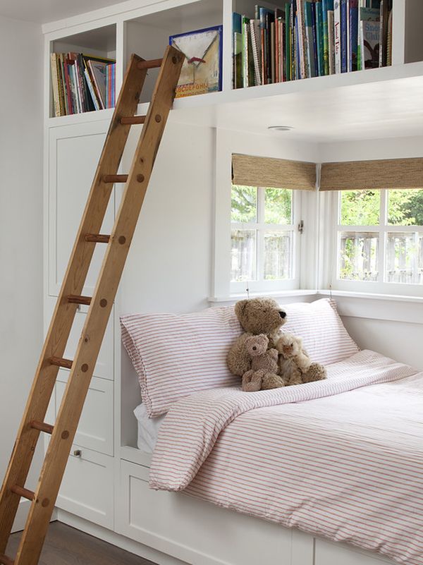 Contemporary kids’ room with alcove bed featuring built-in storage and a ladder