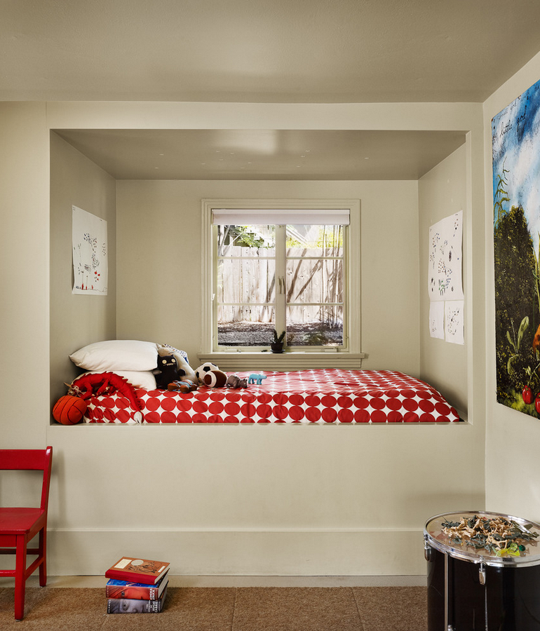 Modern kids room featuring an alcove bed near the window
