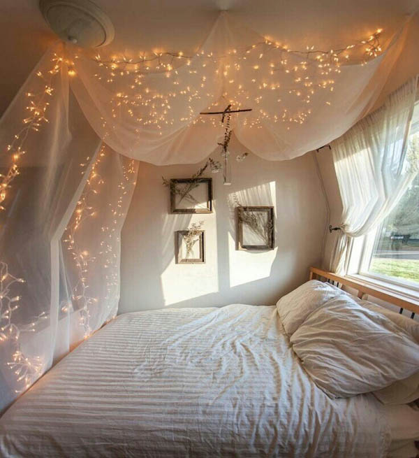 Add a touch of romance to your bedroom with a piece of fabric to use as a billowy canopy with twinkle lights.