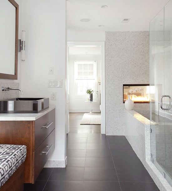 Natural light and small marble tiles make this pretty bath spa-like.