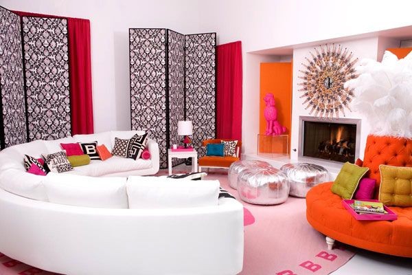 Large Living Room with Round Furniture in Bold Pink, Red, Orange and Silver Colors