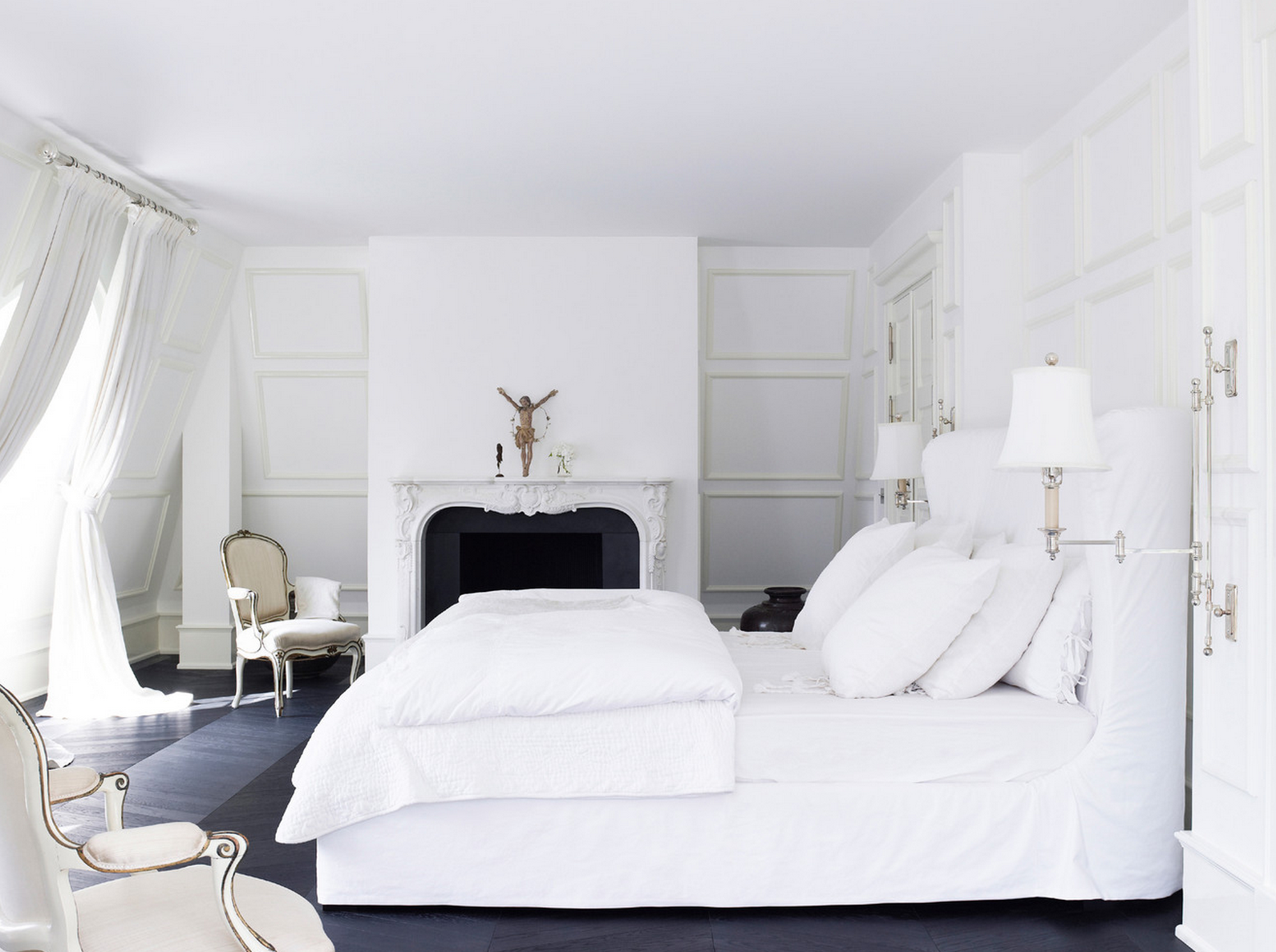 A White Bedroom With A Statement Piece Such As A Chandelier Or A Canopy Bed