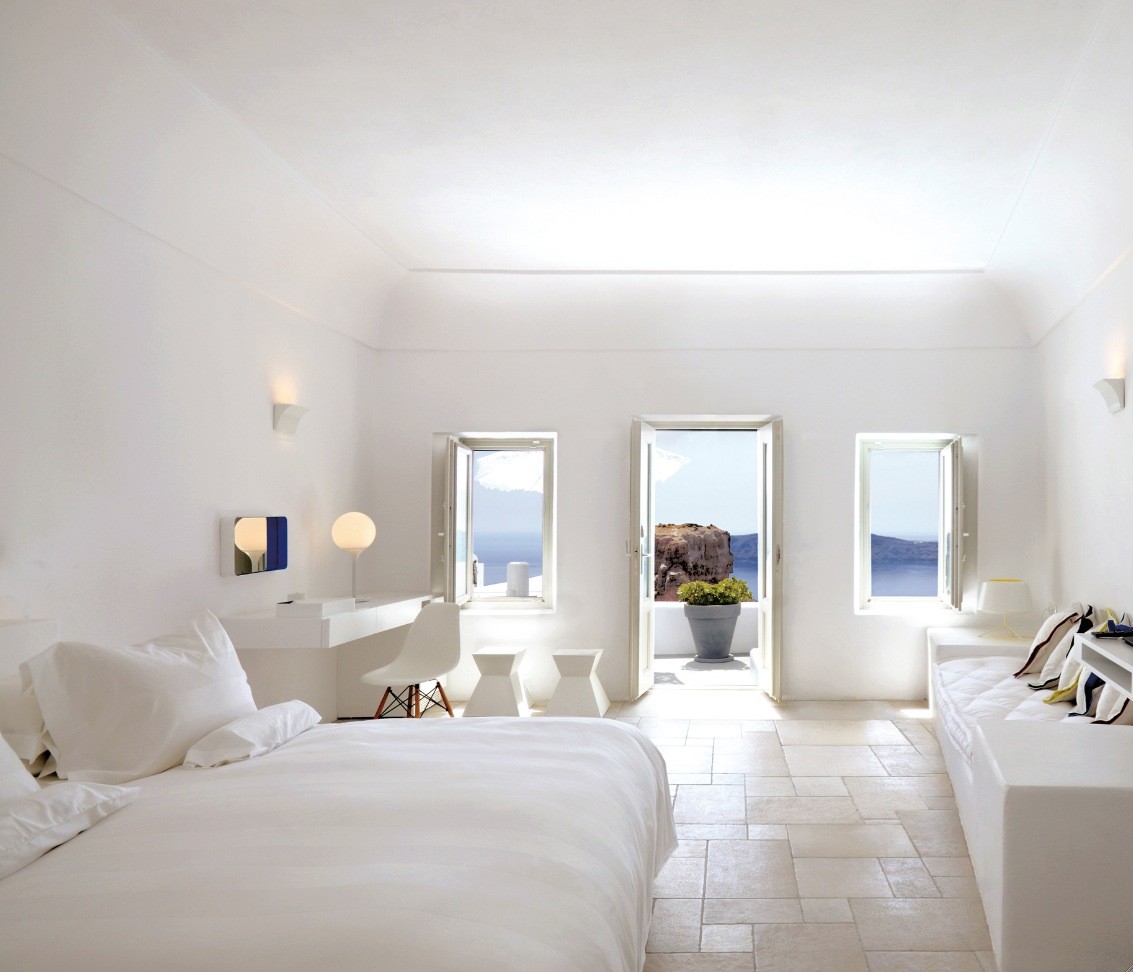 santorini large white bedroom with balcony and view