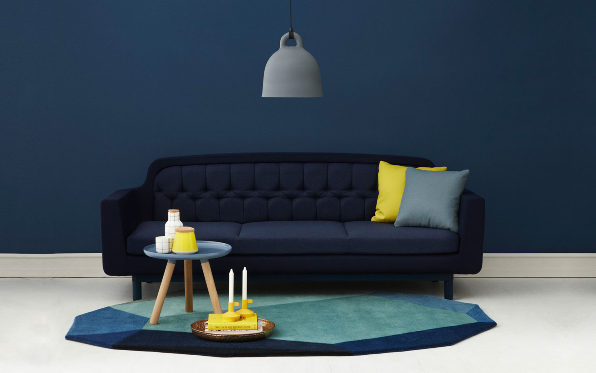 dark blue paint wall interior accent decoration dark blue chesterfield sofa