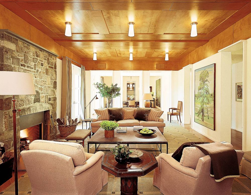 Designers used rich celadon colors in the living room of a New Jersey home. The octagonal table is antique
