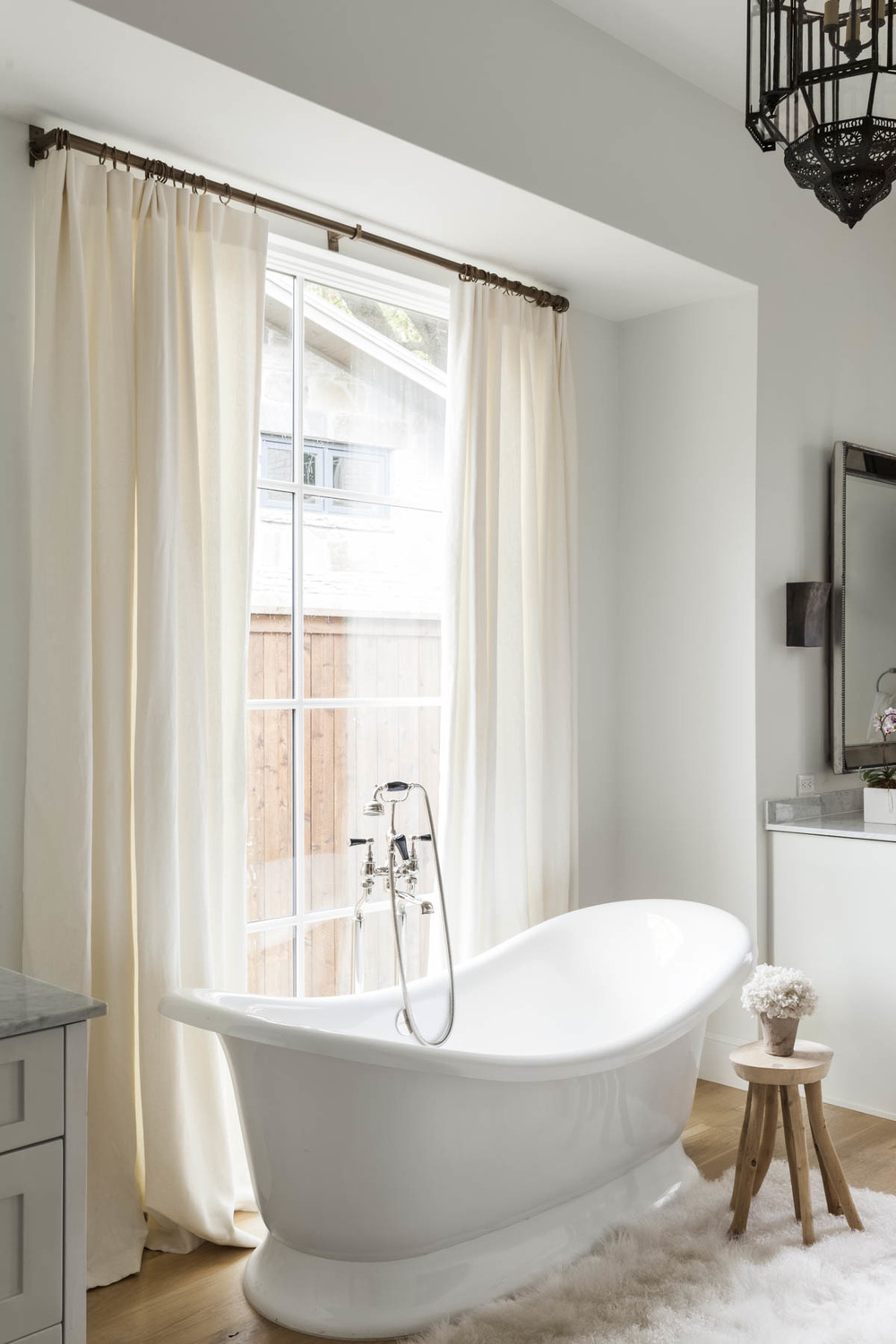 beautiful white bathtub near window
