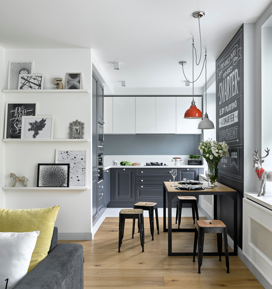Small scandinavian kitchen with raised panel gray cabinets and light hardwood floors