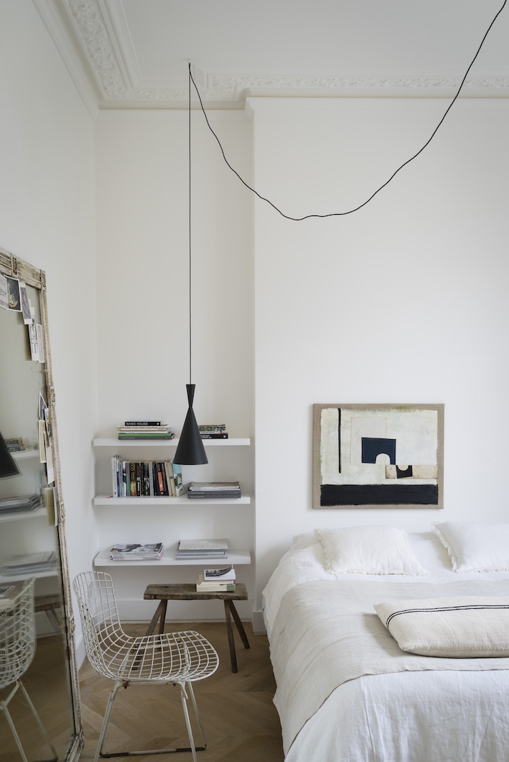Black Lamp, Bookshelf, Stylish Bertoia Chair in Bedroom