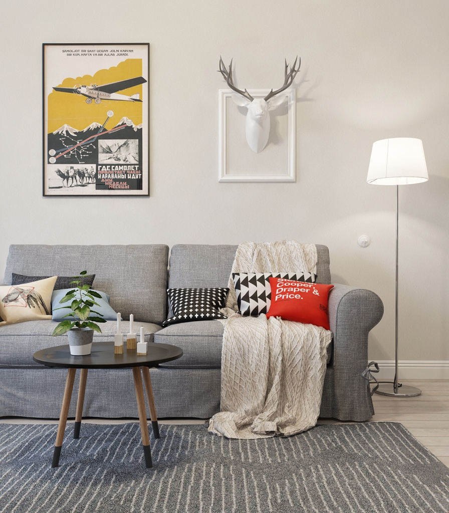 hanging deer decoration in living room with space gray colored sofa and rug