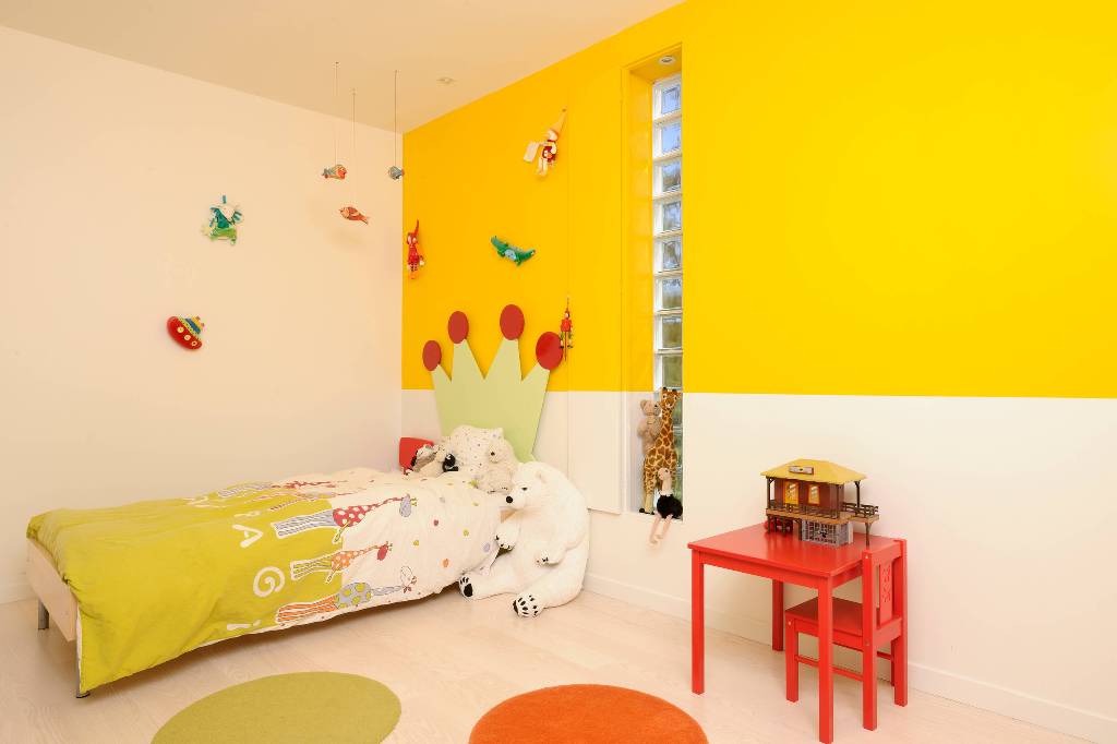 Yellow wall in kids room