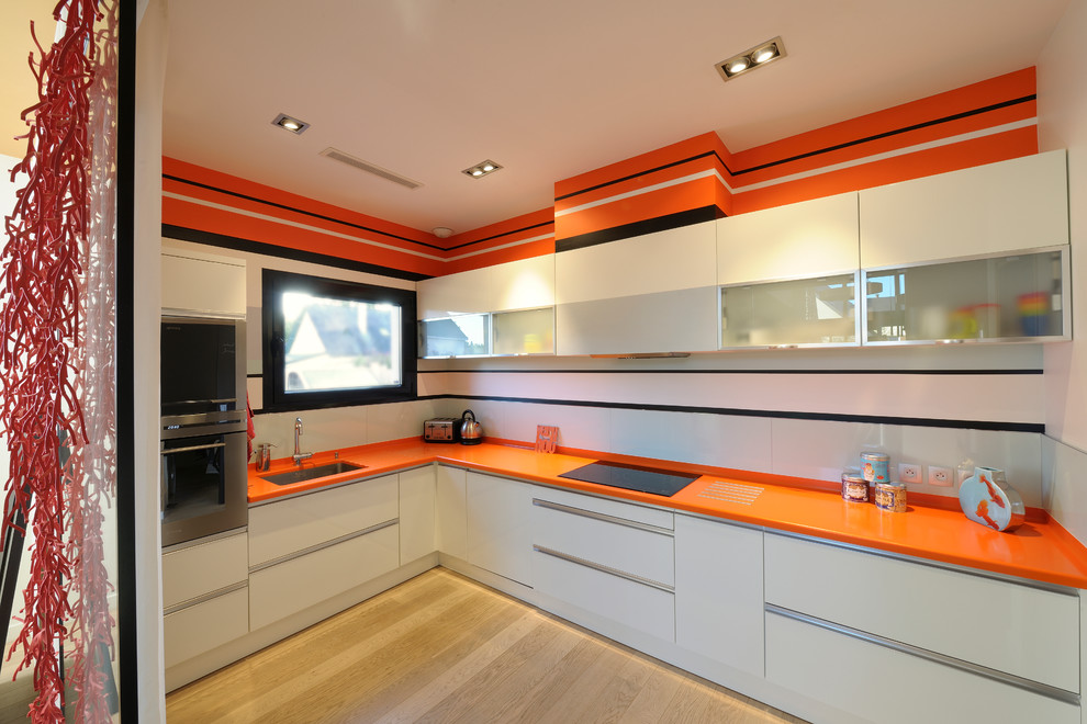 white drawer orange cabinet kitchen design