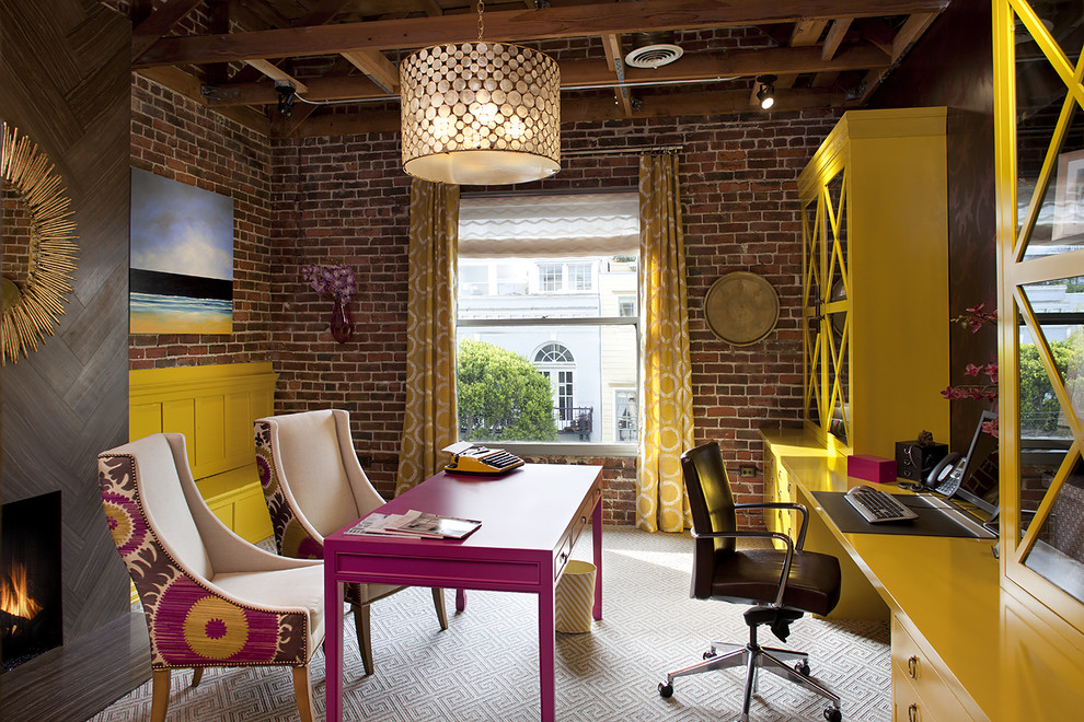 Brick wall, floating desk with guest chairs