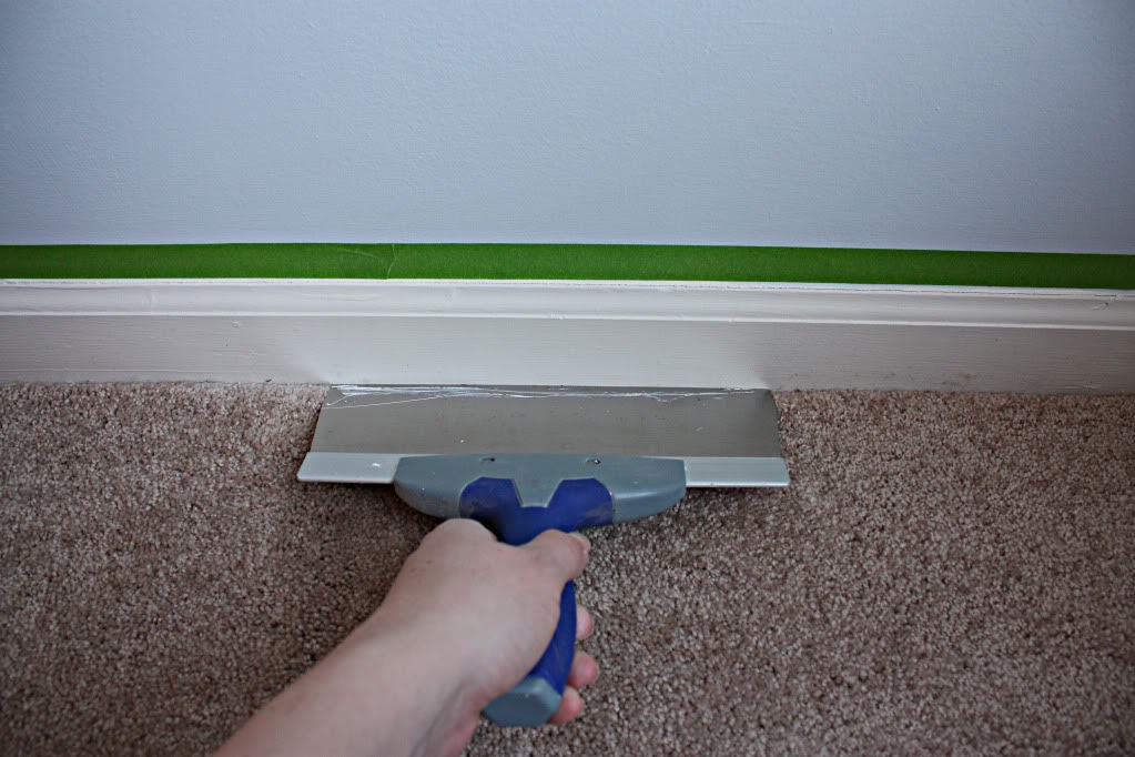 Taping the baseboard and the Carpet