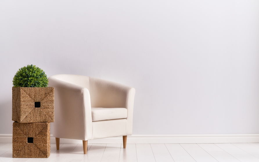 armchair on empty wall