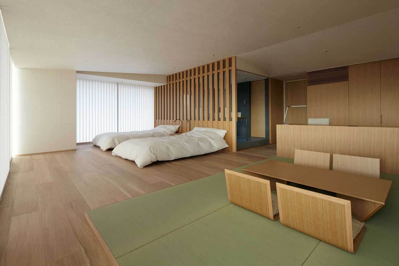 Relaxing wooden bedroom in a traditional Japanese style interior hotel room
