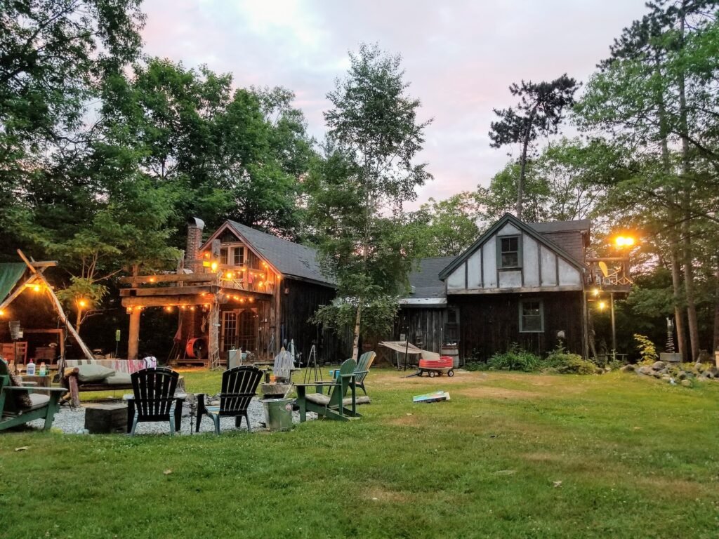 A large backyard with furniture and lights